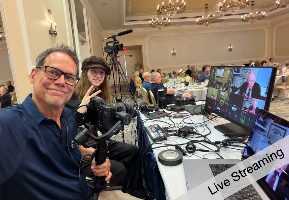 Live-streaming video production equipment and crew at an event